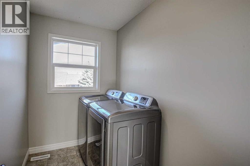 40 Prestwick Manor Se, Calgary, AB - Indoor Photo Showing Laundry Room