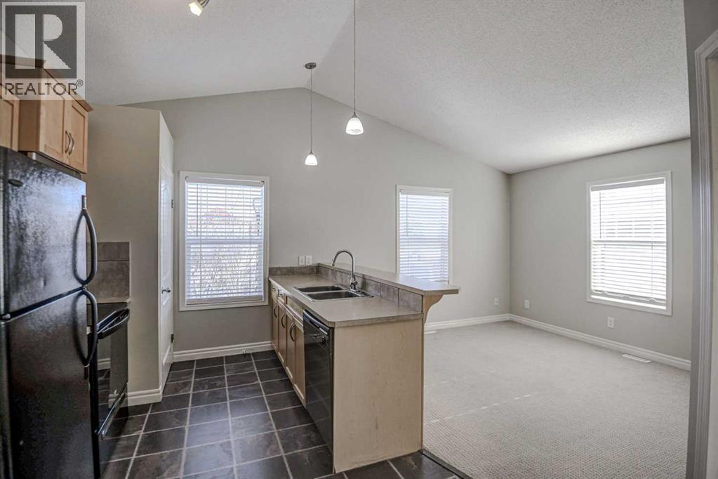 40 Prestwick Manor Se, Calgary, AB - Indoor Photo Showing Kitchen With Double Sink