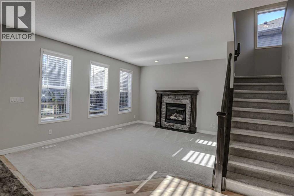 40 Prestwick Manor Se, Calgary, AB - Indoor With Fireplace