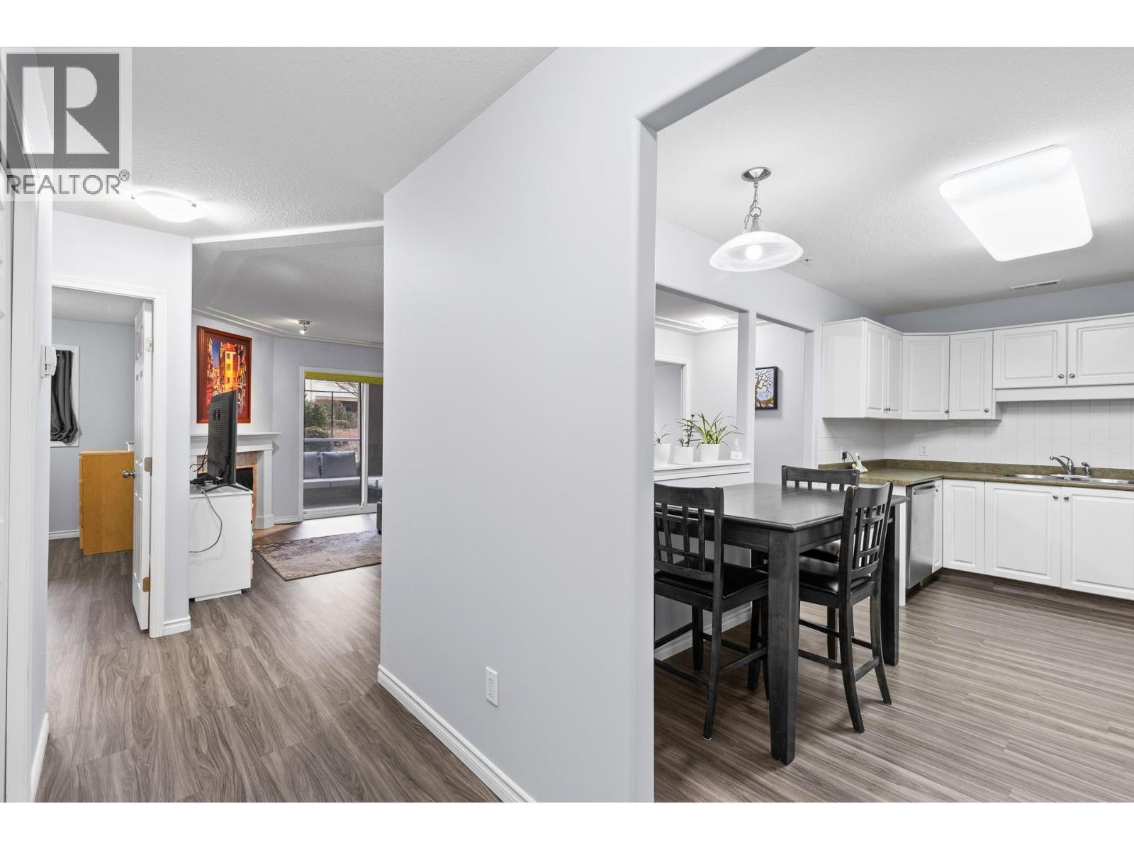 Walk-through Kitchen with room for a dining table - 1966 Durnin Road Unit# 105, Kelowna, BC - Indoor Photo Showing Other Room