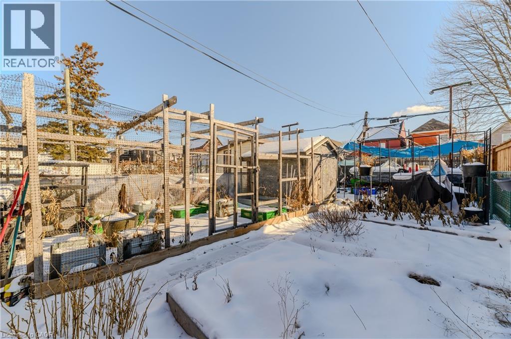 Fenced yard featuring a patio area - 126 Tisdale Street N, Hamilton, ON - Outdoor