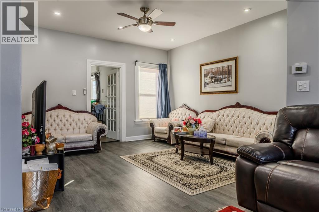 Living area featuring wood finished floors, recessed lighting, and ceiling fan - 126 Tisdale Street N, Hamilton, ON - Indoor Photo Showing Living Room