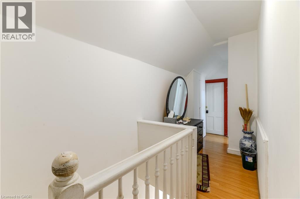 Hall with an upstairs landing, vaulted ceiling, and light wood finished floors - 126 Tisdale Street N, Hamilton, ON - Indoor Photo Showing Other Room