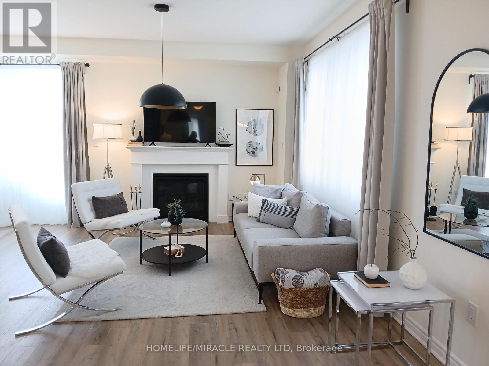 919 Ash Gate, Milton, ON - Indoor Photo Showing Living Room With Fireplace