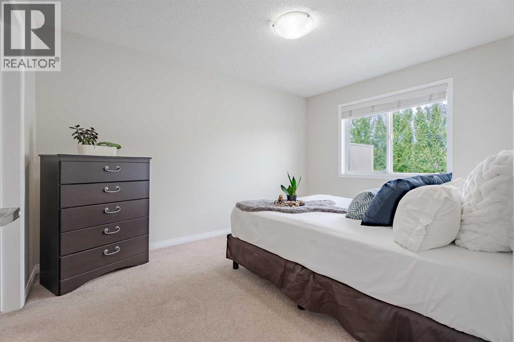 3005 Windsong Boulevard Sw, Airdrie, AB - Indoor Photo Showing Bedroom
