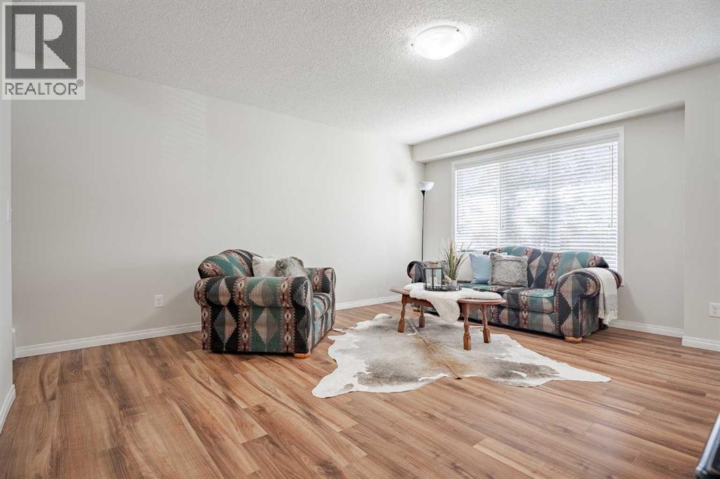 3005 Windsong Boulevard Sw, Airdrie, AB - Indoor Photo Showing Living Room