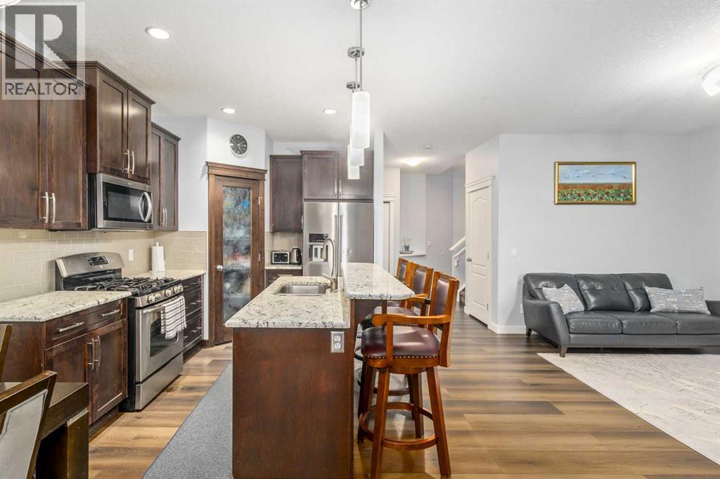 254 Silverado Plains Circle Sw, Calgary, AB - Indoor Photo Showing Kitchen With Double Sink With Upgraded Kitchen