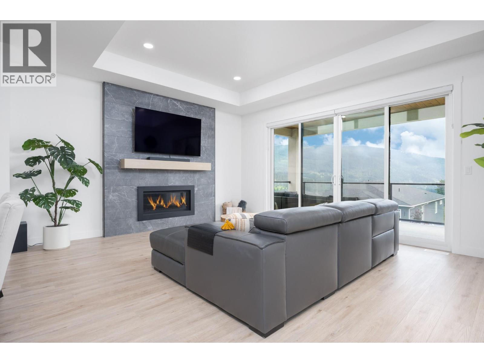 137 Whitefish Road, Vernon, BC - Indoor Photo Showing Living Room With Fireplace