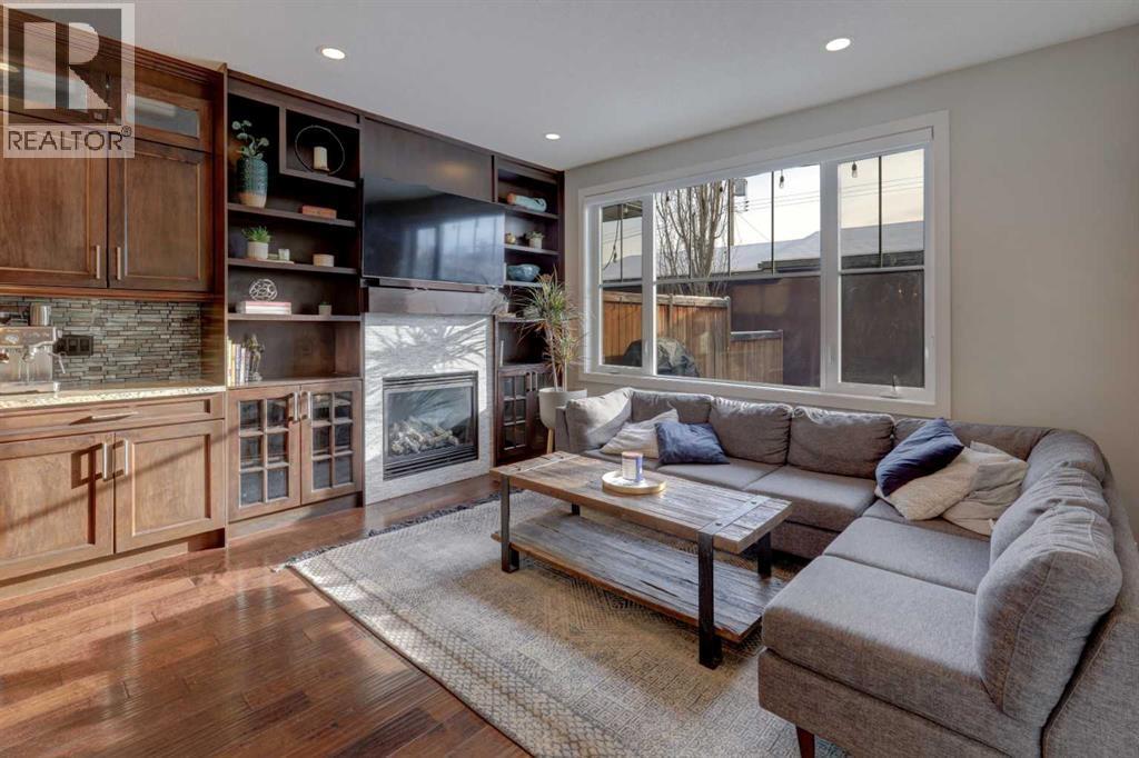 1721 20 Avenue Nw, Calgary, AB - Indoor Photo Showing Living Room With Fireplace