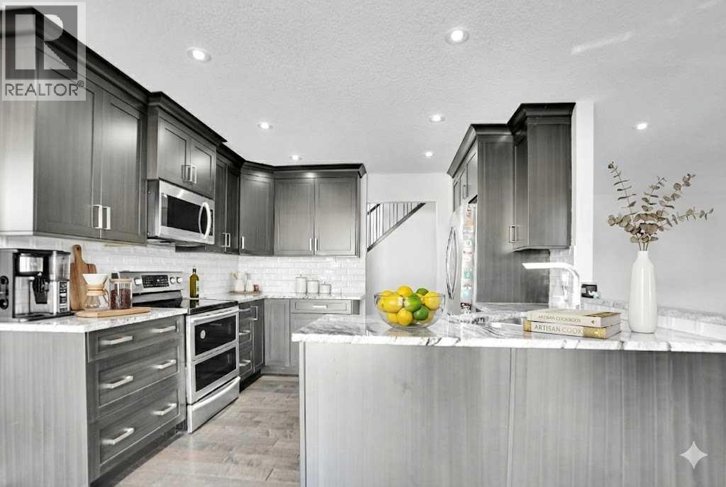 33 Douglasbank Rise Se, Calgary, AB - Indoor Photo Showing Kitchen With Upgraded Kitchen
