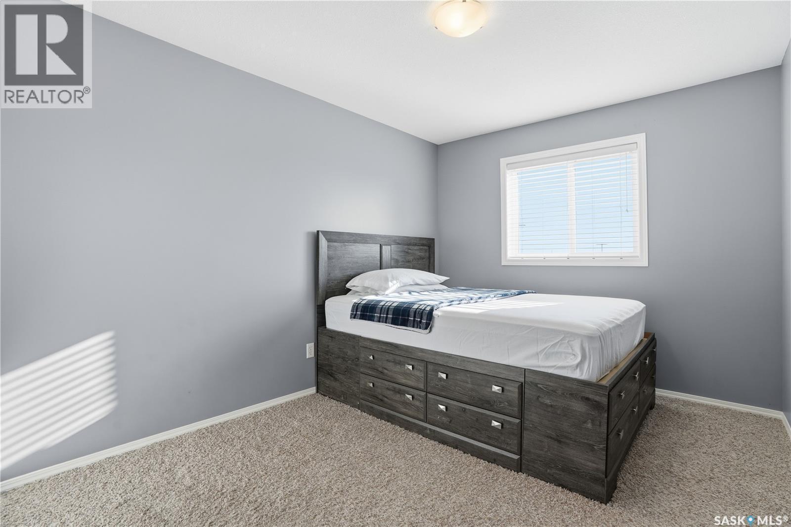18 4425 Nicurity Drive, Regina, SK - Indoor Photo Showing Bedroom