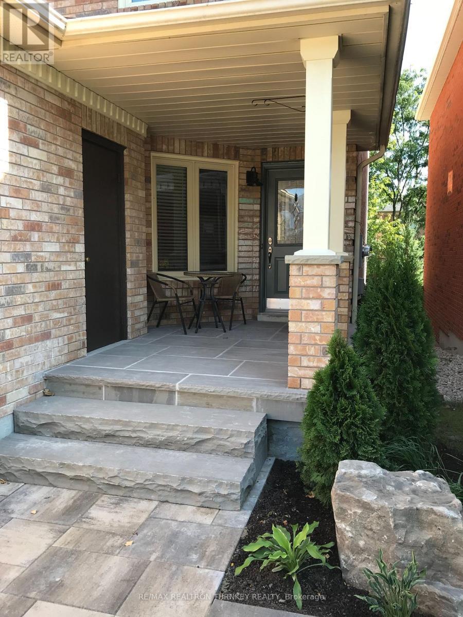 Prof Landscaped, Stone Entrance with Garage Access - 407 Seneca Court, Newmarket, ON - Outdoor With Deck Patio Veranda
