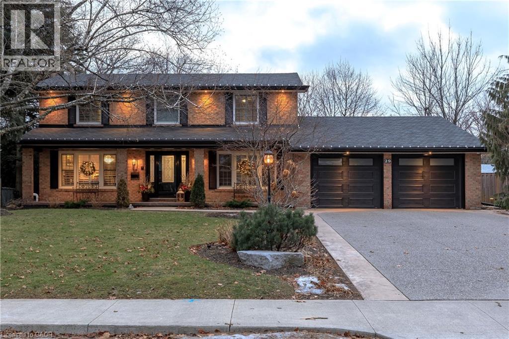 Front exterior -Double Wide and long Aggregate driveway. - 29 Woodside Drive, Hamilton, ON - Outdoor With Facade