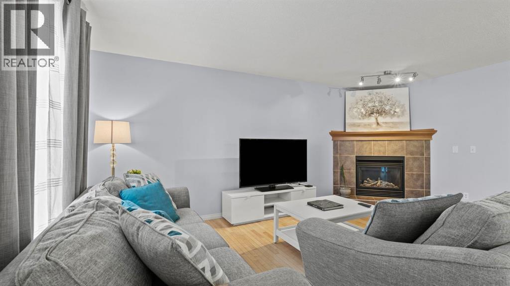 158 Covemeadow Road Ne, Calgary, AB - Indoor Photo Showing Living Room With Fireplace