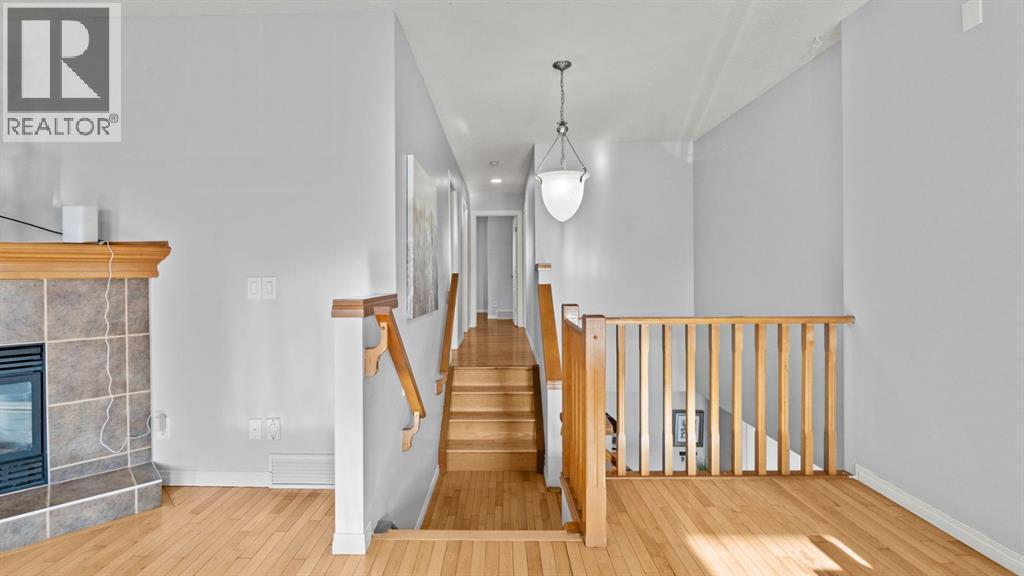 158 Covemeadow Road Ne, Calgary, AB - Indoor Photo Showing Other Room With Fireplace