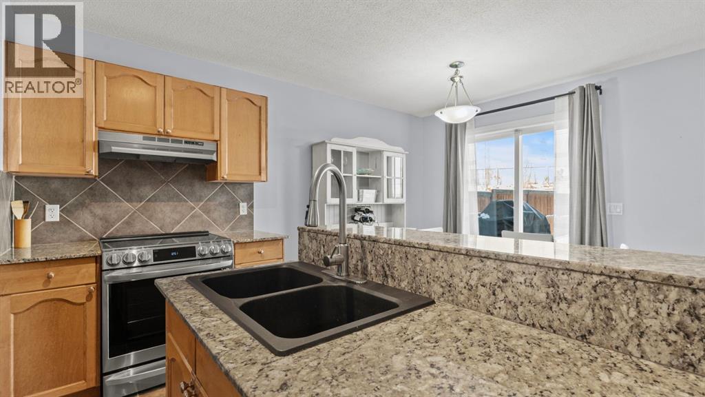 158 Covemeadow Road Ne, Calgary, AB - Indoor Photo Showing Kitchen With Double Sink