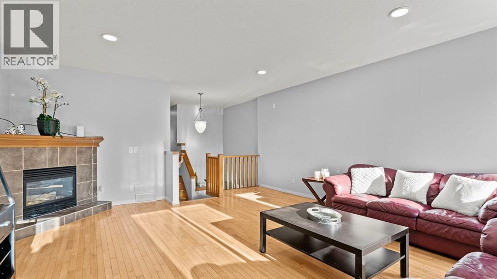 158 Covemeadow Road Ne, Calgary, AB - Indoor Photo Showing Living Room With Fireplace