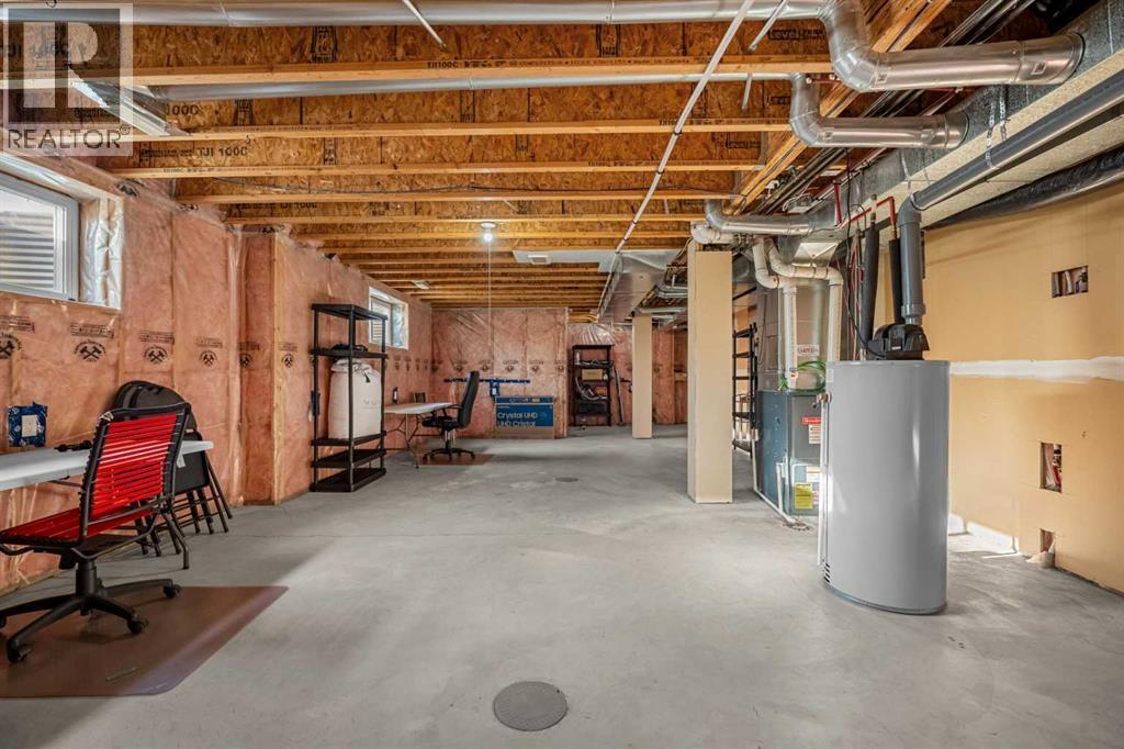 1101, 281 Cougar Ridge Drive Sw, Calgary, AB - Indoor Photo Showing Basement