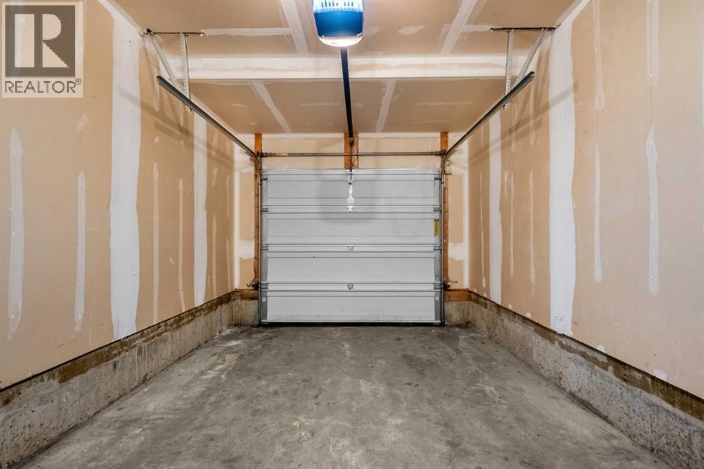 1101, 281 Cougar Ridge Drive Sw, Calgary, AB - Indoor Photo Showing Garage
