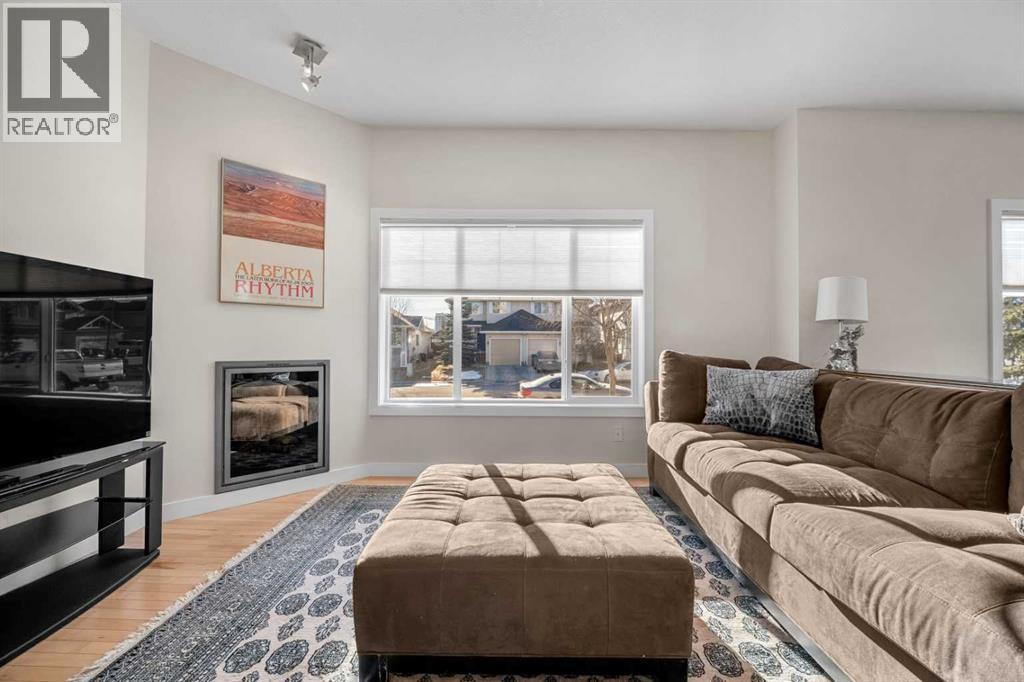 1101, 281 Cougar Ridge Drive Sw, Calgary, AB - Indoor Photo Showing Living Room With Fireplace