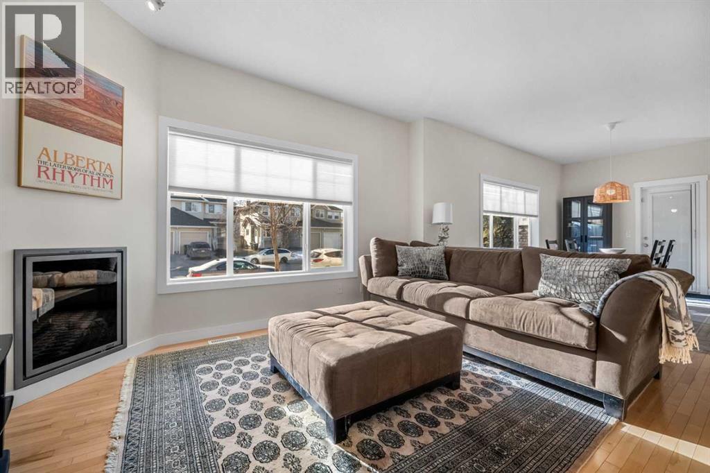 1101, 281 Cougar Ridge Drive Sw, Calgary, AB - Indoor Photo Showing Living Room With Fireplace