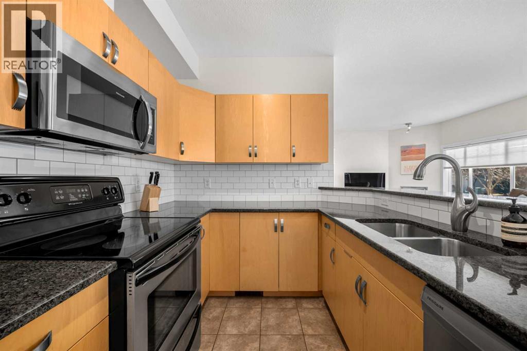 1101, 281 Cougar Ridge Drive Sw, Calgary, AB - Indoor Photo Showing Kitchen With Double Sink