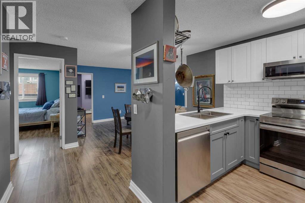 202, 1915 26 Street Sw, Calgary, AB - Indoor Photo Showing Kitchen With Stainless Steel Kitchen With Double Sink