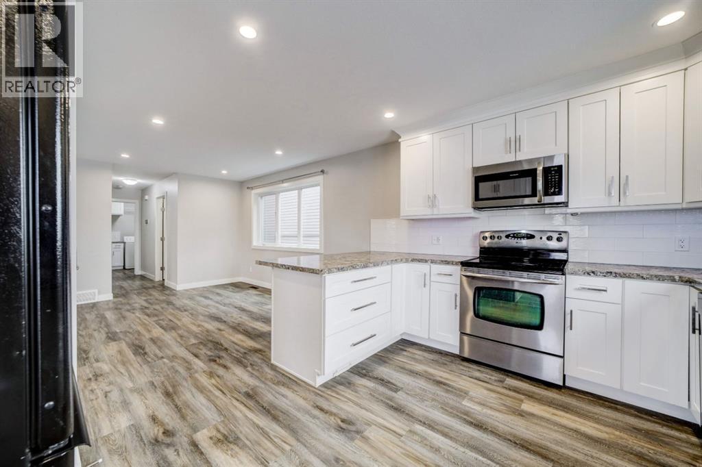 Kitchen Facing Dining Room - 203 1 Street, Shaughnessy, AB - Indoor Photo Showing Kitchen