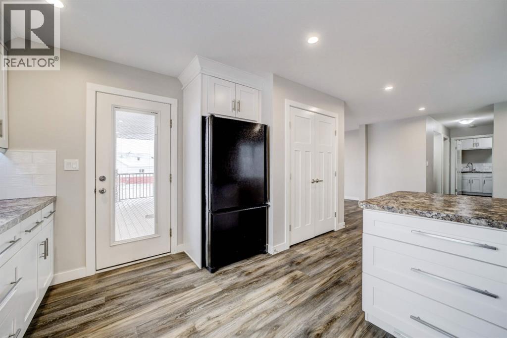 Wrap-Around Porch Access - 203 1 Street, Shaughnessy, AB - Indoor Photo Showing Kitchen