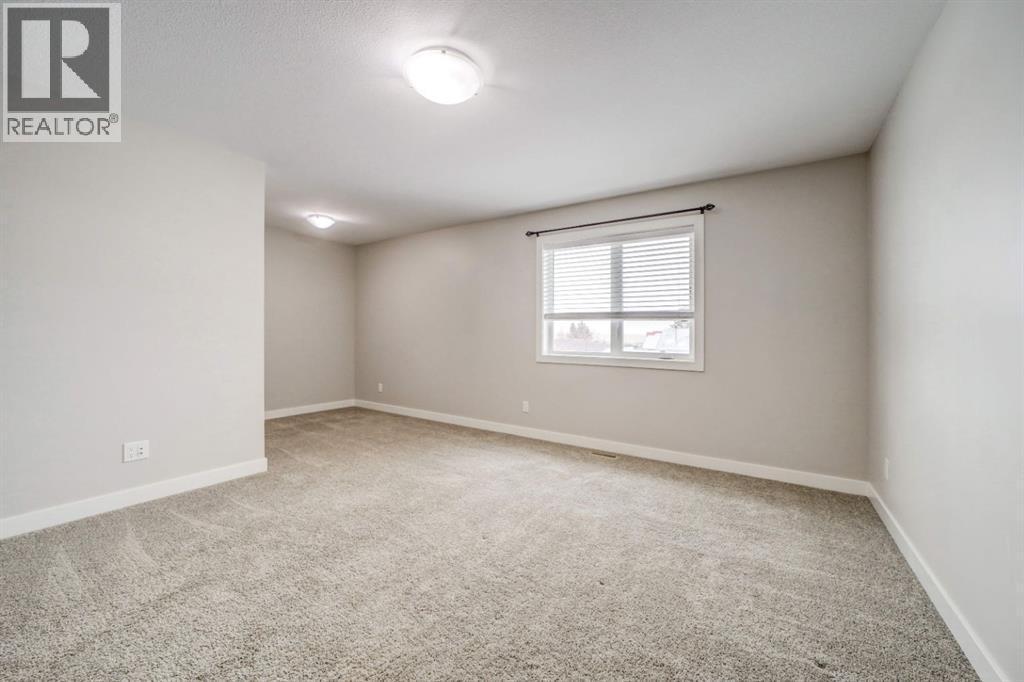 Master Bedroom - 203 1 Street, Shaughnessy, AB - Indoor Photo Showing Other Room