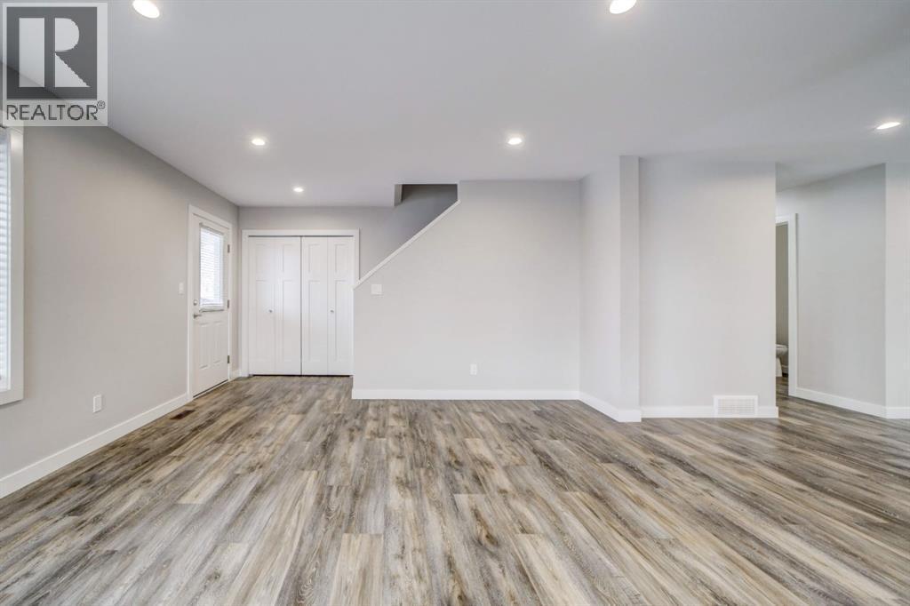 Living Room Facing Entry - 203 1 Street, Shaughnessy, AB - Indoor Photo Showing Other Room