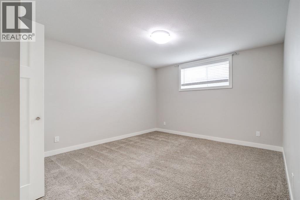 Basement Bedroom #1 - 203 1 Street, Shaughnessy, AB - Indoor Photo Showing Other Room