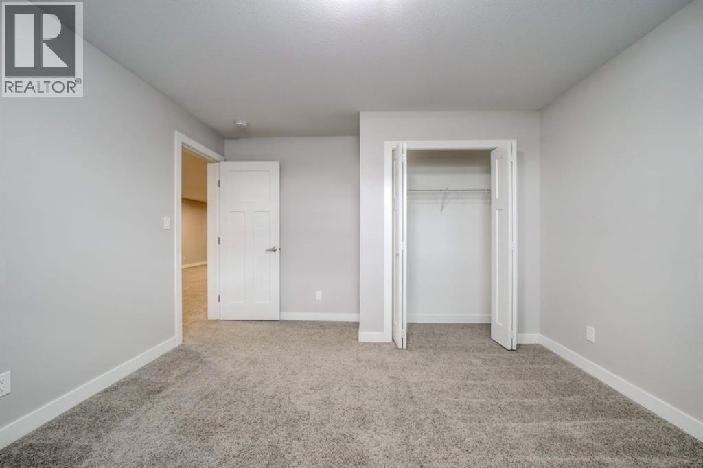 Basement Bedroom #1 - 203 1 Street, Shaughnessy, AB - Indoor Photo Showing Other Room