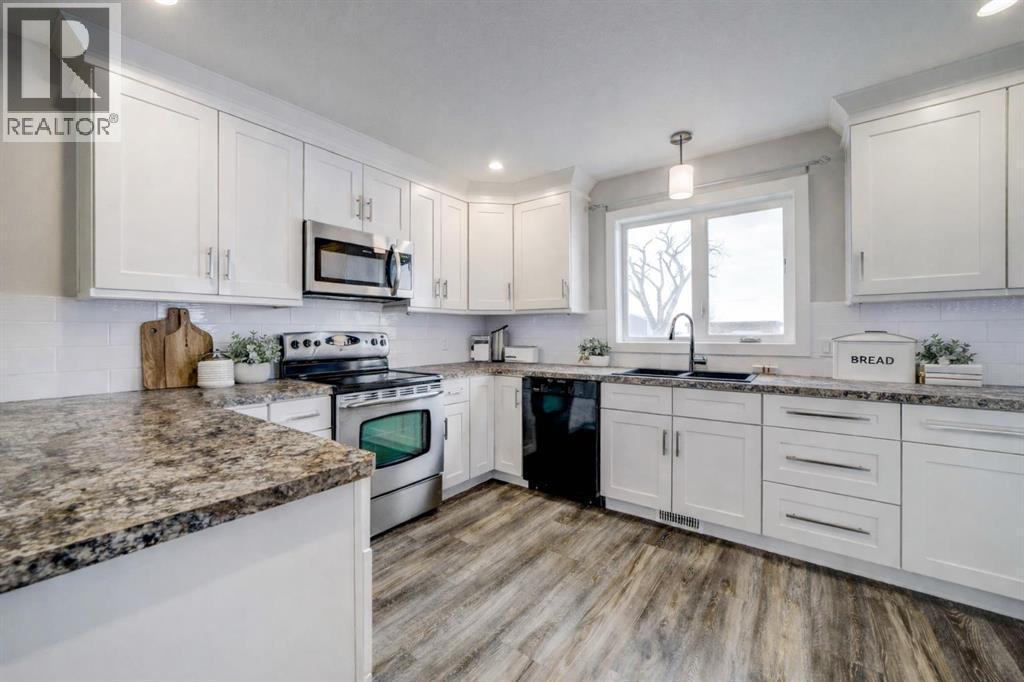 Virtually Staged - 203 1 Street, Shaughnessy, AB - Indoor Photo Showing Kitchen With Upgraded Kitchen