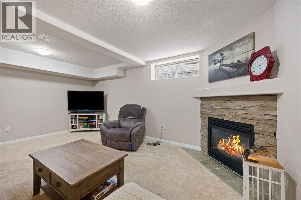 3904 63 Avenue, Lloydminster, AB - Indoor Photo Showing Living Room With Fireplace
