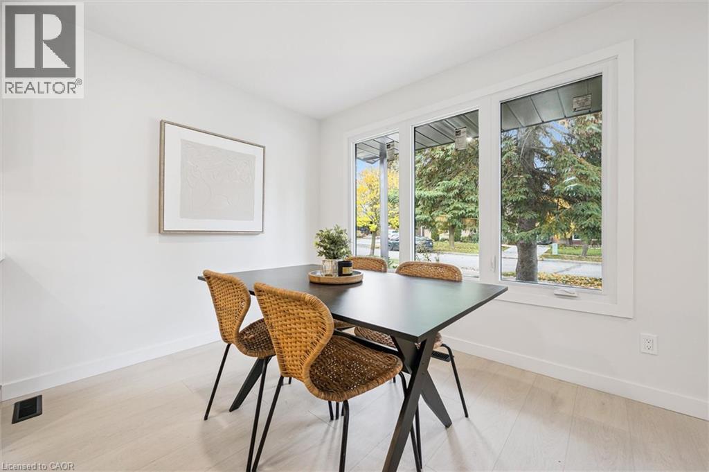 Dining space featuring baseboards and light wood-type flooring - 459 Drummerhill Crescent, Waterloo, ON - Indoor Photo Showing Dining Room