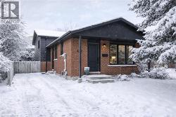 View of front of property featuring brick siding -