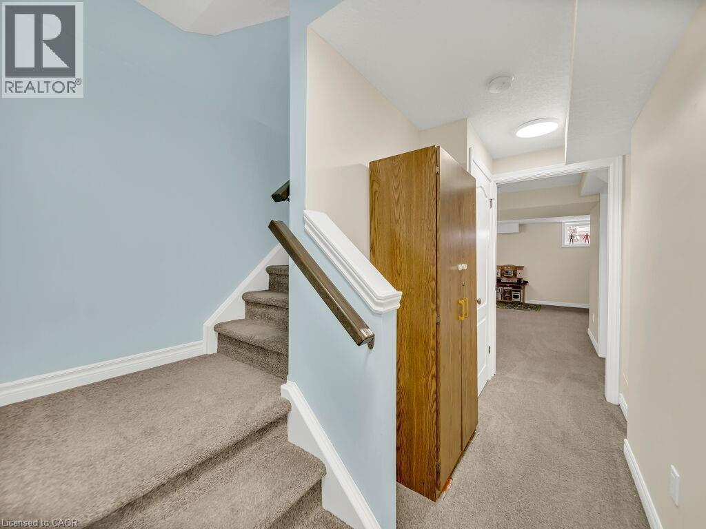 Stairway with carpet and baseboards - 29 Amsterdam Crescent, Guelph, ON - Indoor Photo Showing Other Room