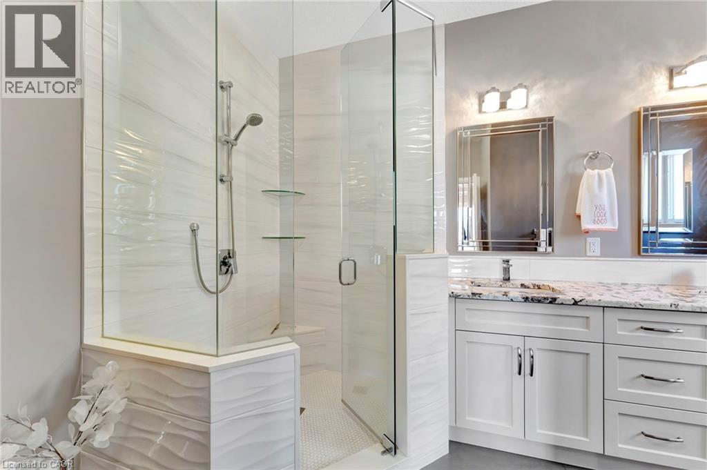 Full bath with vanity and a stall shower - 107 Forbes Crescent, Listowel, ON - Indoor Photo Showing Bathroom