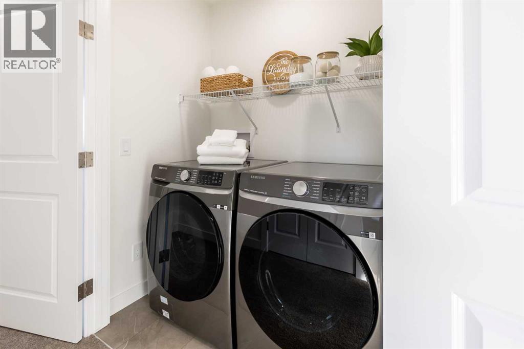 67 Appaloosa Way, Cochrane, AB - Indoor Photo Showing Laundry Room