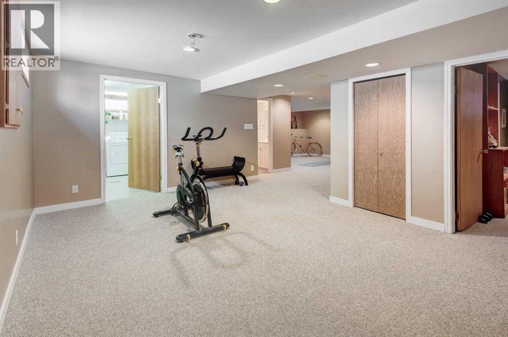 9 Mountain Place, Okotoks, AB - Indoor Photo Showing Gym Room