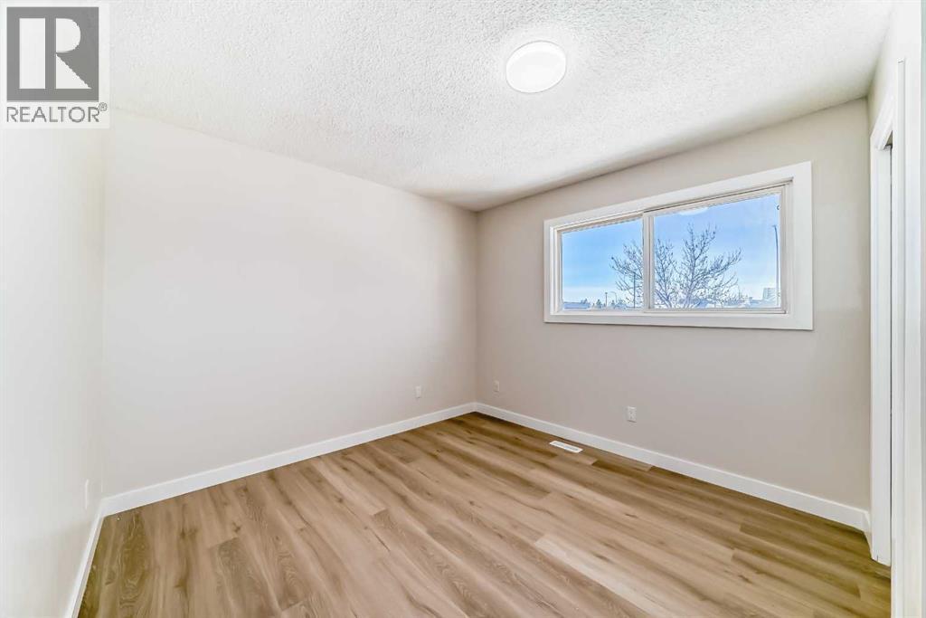 6128 Madigan Drive Ne, Calgary, AB - Indoor Photo Showing Other Room