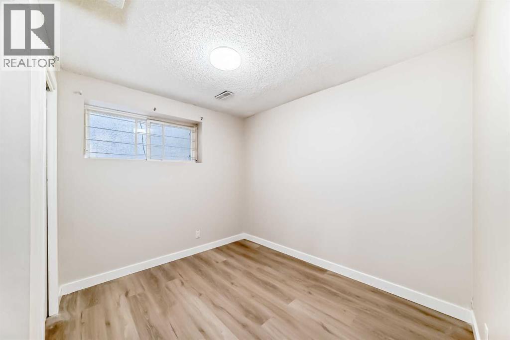 6128 Madigan Drive Ne, Calgary, AB - Indoor Photo Showing Other Room