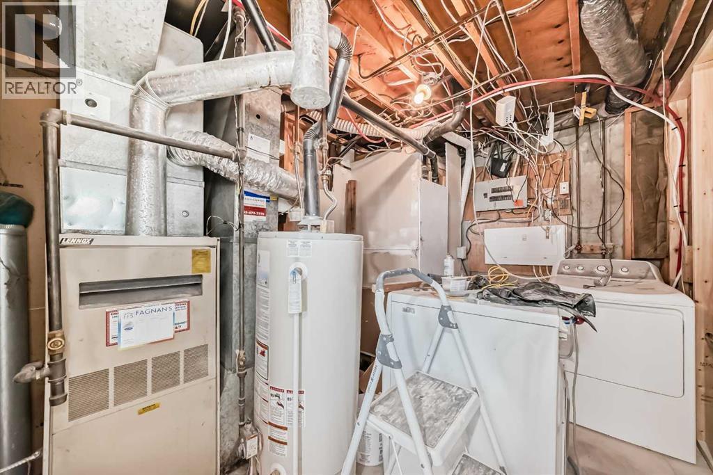 6128 Madigan Drive Ne, Calgary, AB - Indoor Photo Showing Laundry Room