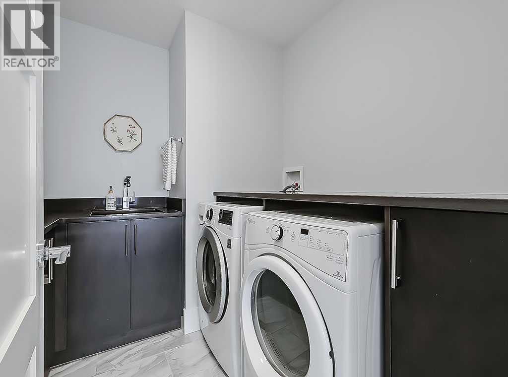 14 Rosetree Road Nw, Calgary, AB - Indoor Photo Showing Laundry Room