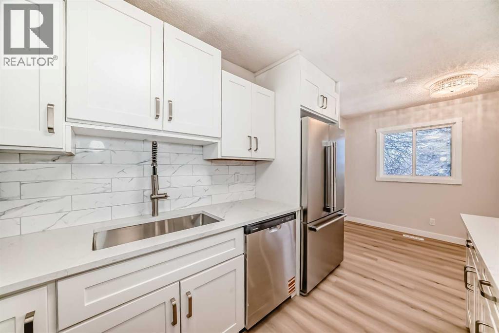 937 Marcombe Drive Ne, Calgary, AB - Indoor Photo Showing Kitchen With Double Sink