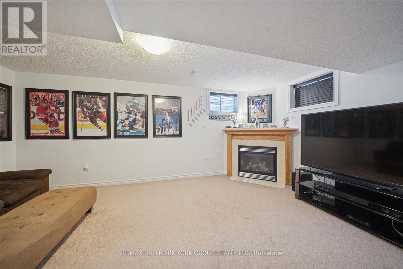 70 - 50 Southwoods Crescent, Barrie, ON - Indoor Photo Showing Other Room With Fireplace