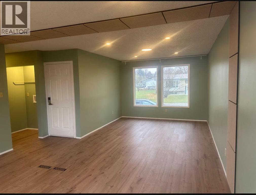 view from kitchen - 52 Wildrose Crescent, Brooks, AB - Indoor Photo Showing Other Room