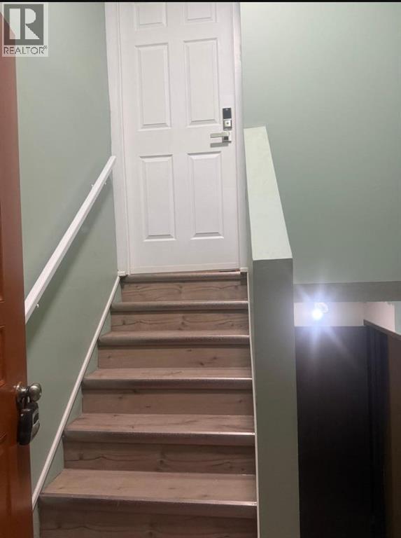 main floor suite - 52 Wildrose Crescent, Brooks, AB - Indoor Photo Showing Other Room