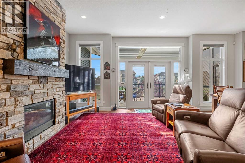 2253 Bayside Road Sw, Airdrie, AB - Indoor Photo Showing Living Room With Fireplace